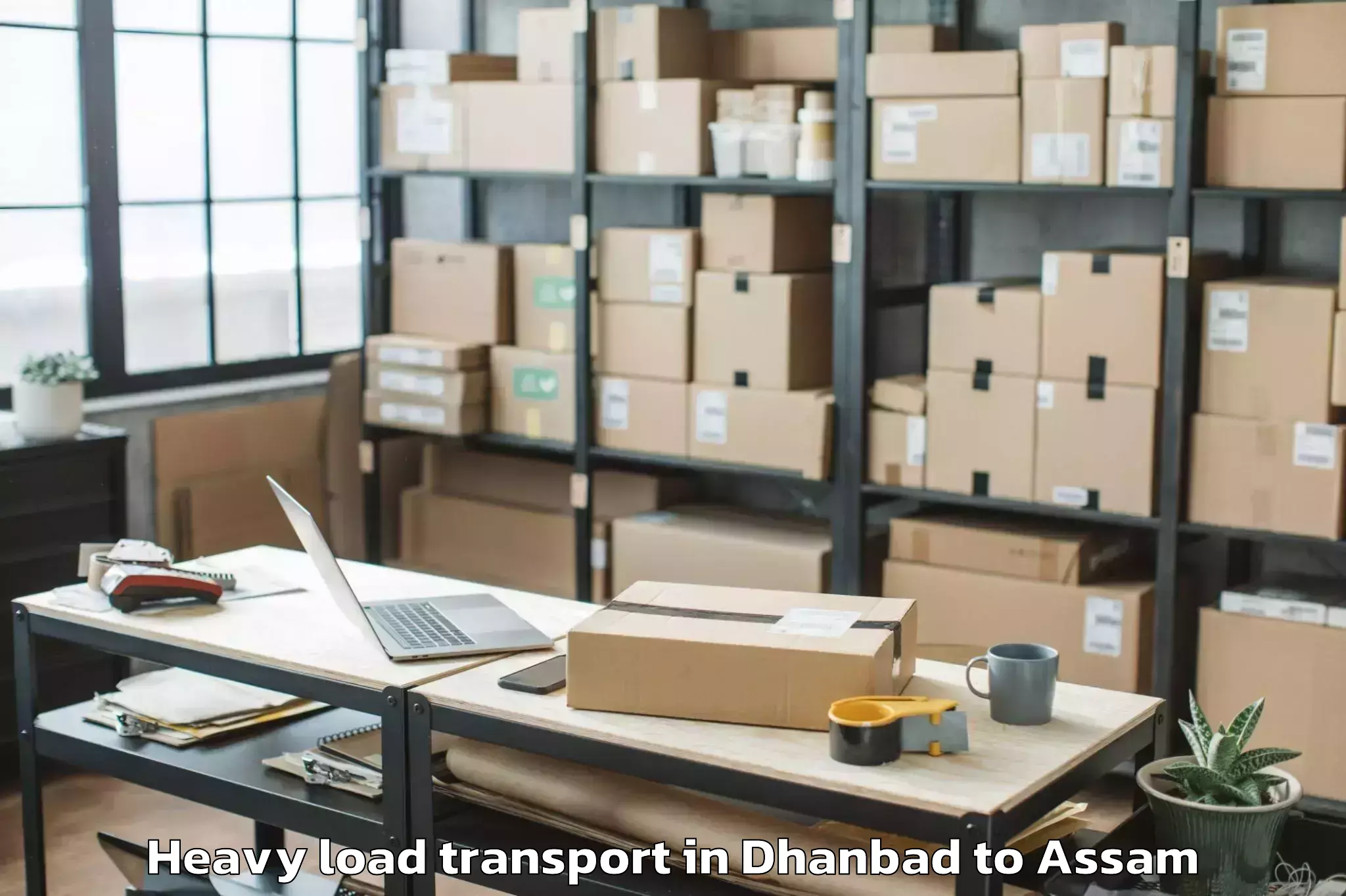 Easy Dhanbad to Darangamela Heavy Load Transport Booking